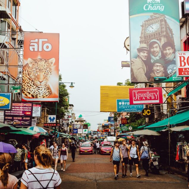 pathway with assorted product displays with people walking